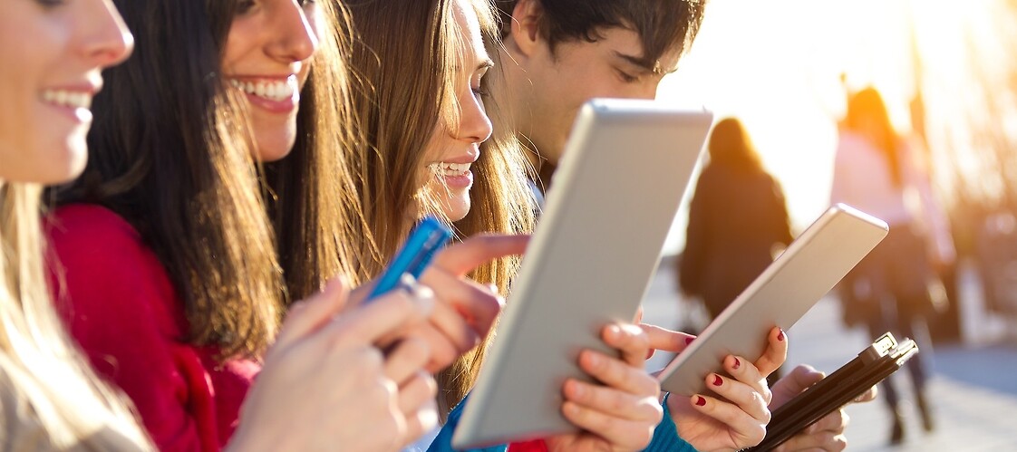 Young people with tablets and smartphones