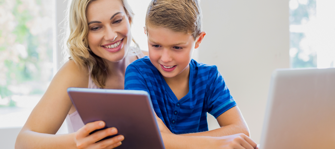 A woman  and a boy with tablet