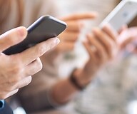 Hands holding smartphones