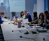 A group of people at a conference table