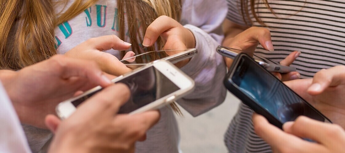 Hand of young people with smartphones